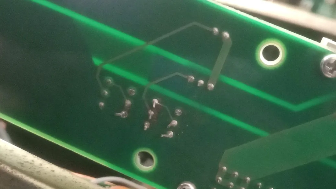 Solder side of the same board with the three fan connector pads marked.