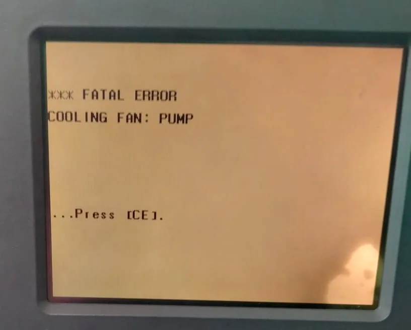 Shimadzu LC-2010 front panel showing three asterisks, FATAL ERROR, COOLING FAN colon PUMP, and Press CE.